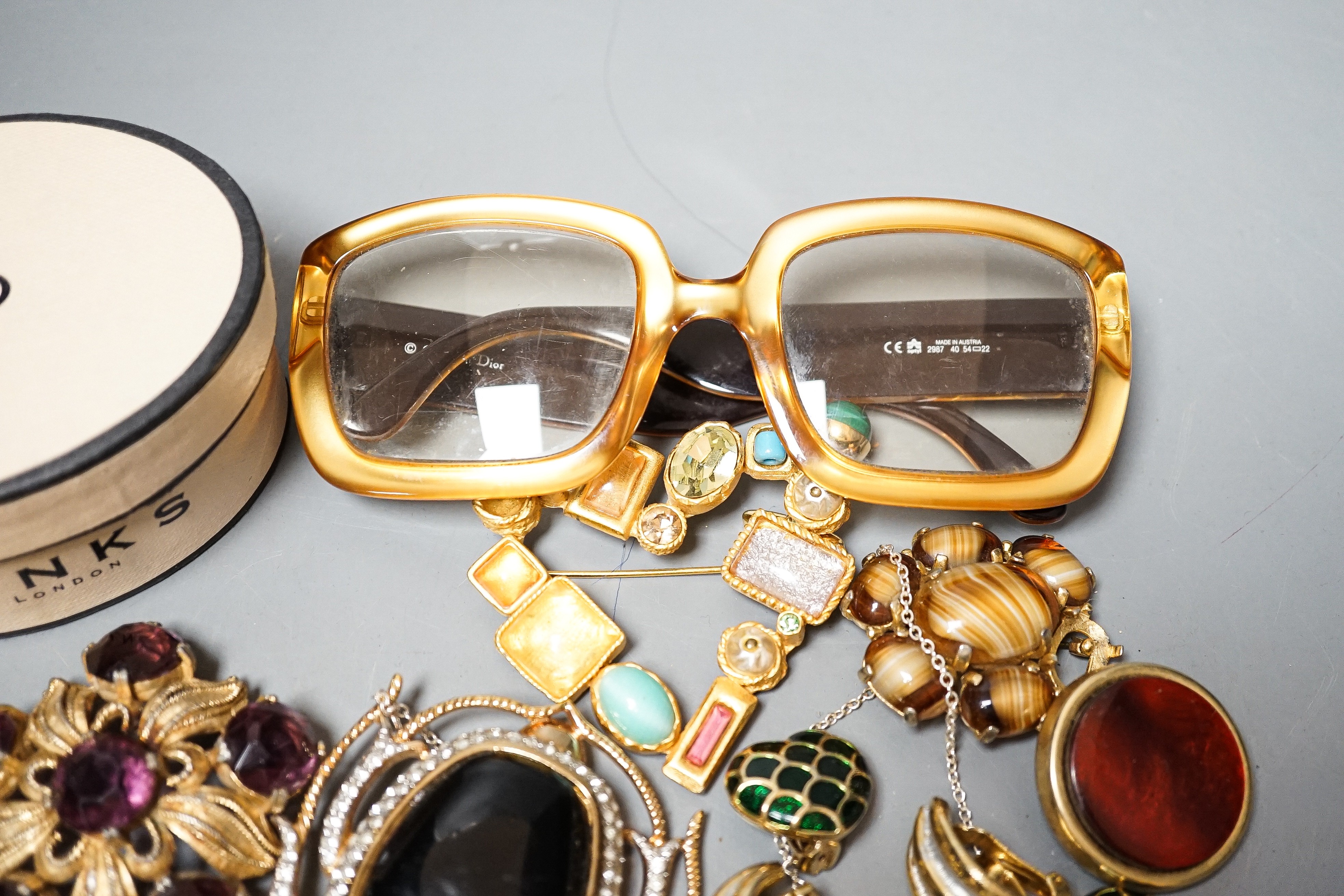 A mixed lot of costume jewellery including Christian Lacroix, scarab brooch stamped Valentino, Dior glasses etc.